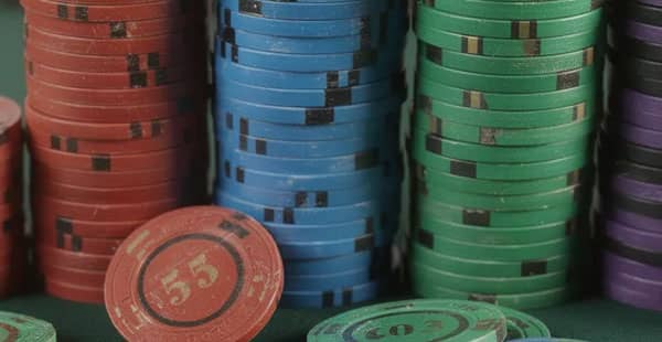 The image features stacks of colorful casino chips, each representing different denominations, symbolizing the excitement of casino games and the potential for bonus winnings. These vibrant chips can be associated with various deposit bonuses and promotions found in online casinos.